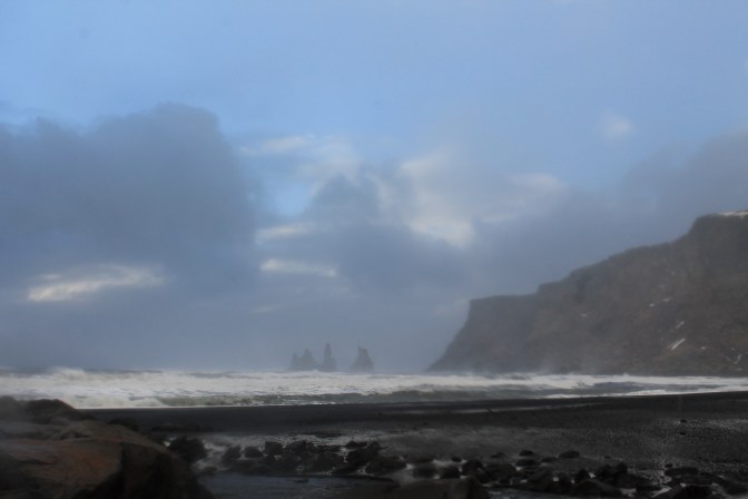 Gale-force winds in Vik covered us in loose volcanic sand. It was black in our teeth!